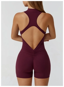 Detail view of the open-back design and ruched lifting effect on dark red sports bodysuit