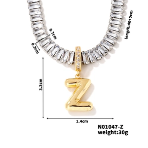 Detail view of gold letter Z pendant with dimension labels and cz stone measurements