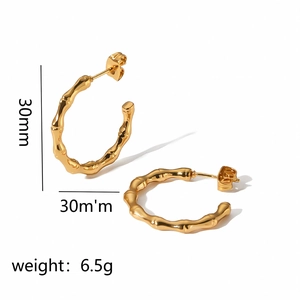 Detail view of gold 18k bamboo hoop earrings showing 30mm diameter and 6.5g weight info