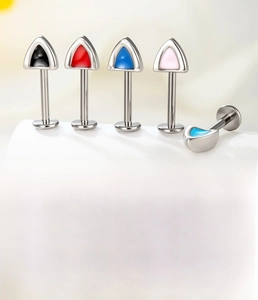 Detailed set of titanium cat ear labrets in five vibrant enamel colors with silver finish