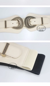 Detail of vintage wide elastic belt with textured metal buckle and beaded gold trim