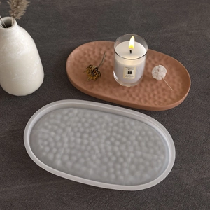 Macro detail of oval ripple pattern silicone mold for resin with finished coaster