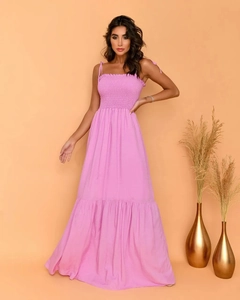 Detail of pink tiered maxi dress featuring ruched bodice and adjustable shoulder straps