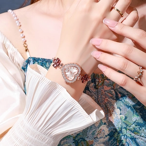 Elegant rose gold heart-shaped watch for women with crystal clover charm bracelet strap