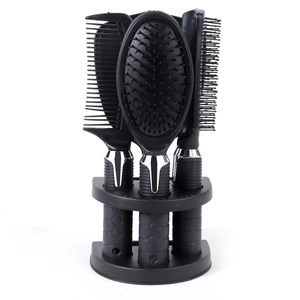 Detail of professional black hair comb set with anti-slip handles and storage base