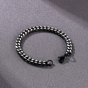 Close-up of black stainless steel Cuban link bracelet with a secure lobster clasp