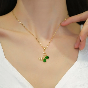 Elegant butterfly necklace set with green and white zircon stones in gold finish