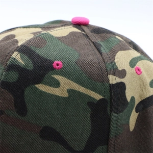 Macro shot of camo baseball cap with pink embroidered eyelets and twill fabric texture