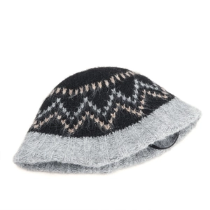Detailed view of winter knit bucket hat showing diamond wave pattern and fuzzy wool texture