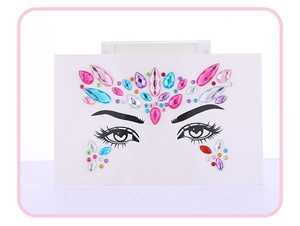 Macro shot of colorful rhinestone face gems in various shapes for festive makeup