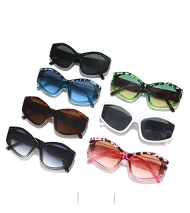 Flat lay of colorful cat-eye sunglasses in leopard print, tortoiseshell and solid frames