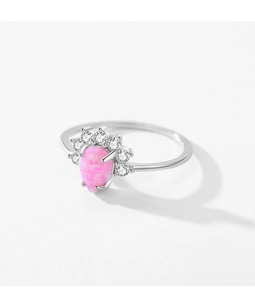 Macro shot of crown-shaped S925 silver ring featuring teardrop pink opal and white zircons