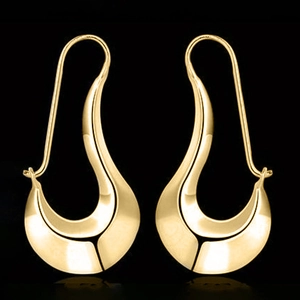 Macro detail of glossy golden irregular teardrop earrings with a smooth metallic finish