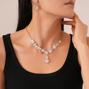Luxury zircon jewelry set featuring geometric teardrop pendant necklace and stud earrings