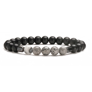 Natural volcanic stone beaded bracelet with cross charm and stainless steel accents