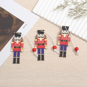 Detailed view of hand-painted wooden nutcracker soldier ornaments on a rustic wood surface