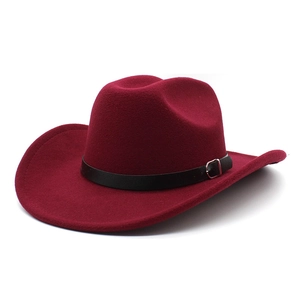 Detailed texture of burgundy wool felt fedora hat featuring a black leather band and buckle
