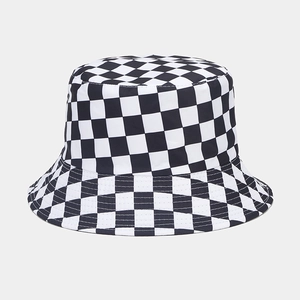 Detail of checkered bucket hat featuring reinforced stitching on the brim and cotton fabric