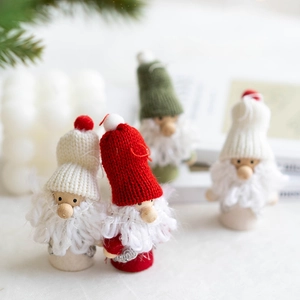 Set of four handmade Christmas gnome ornaments with knitted hats and white wool beards