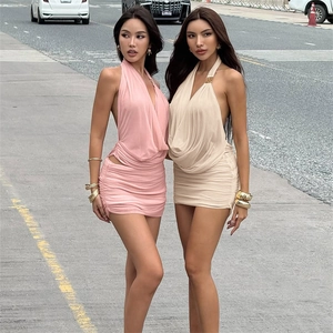 Detail of ruched halter mini dresses in pink and beige with draped front and slim fit