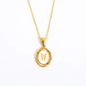 Detail of gold oval pendant with white enamel inlay showing letter W on fine chain