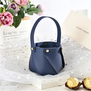 Navy blue faux leather wedding favor bucket with golden rivets and elegant handle detail