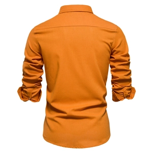 Macro detail of high-quality bright orange fabric texture and fine stitching on shirt back