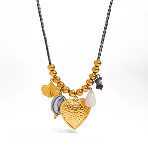 Close-up of 18K gold stainless steel necklace with heart and turquoise charms