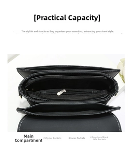Detail view of the black shoulder bag interior showing four compartments and white stitching