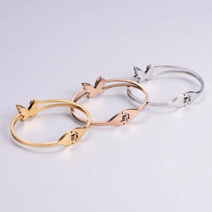 Three-color butterfly open bangle set in gold, rose gold, and silver finishes