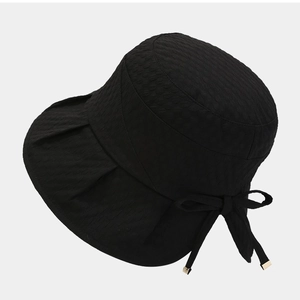 Women's black sun hat with textured honeycomb fabric and elegant back bow decoration