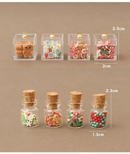 Detailed scale view of miniature Christmas candy boxes and jars for dollhouse decor