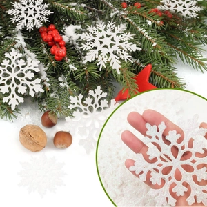 Sparkling white snowflake ornaments for Christmas tree decor in a festive winter scene