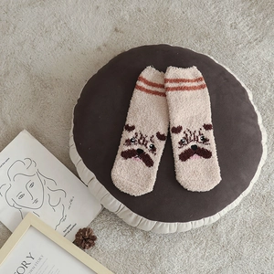 Soft coral fleece socks with cute cartoon animal face design in warm beige and brown