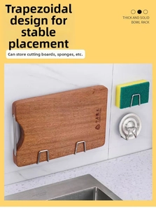 Wall-mounted stainless steel hooks holding a wooden cutting board and sponges in a kitchen