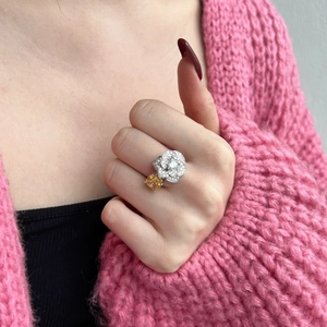 Close-up of S925 silver ring featuring a yellow cushion-cut gem and camellia flower
