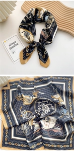 Detail of navy and yellow square silk scarf with vintage carriage and polka dot print