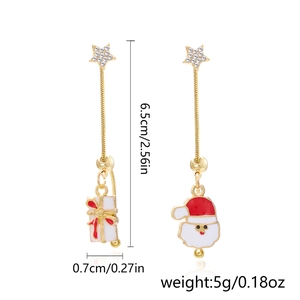 Detail of Christmas earrings featuring Santa Claus and gift box with size measurement