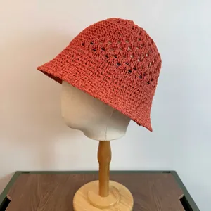 Summer hollow knit bucket hat for women in rust red, breathable crochet sun protection cap
