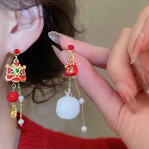 New Chinese-style festive lion dance earrings with red lucky pouch and pearls