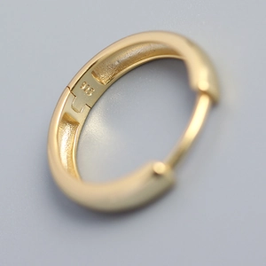 Polished gold S925 sterling silver hoop earrings with minimalist circular design