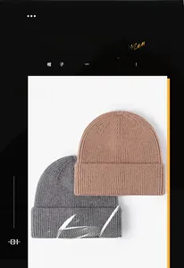 Close-up of light brown and grey knitted beanies with premium ribbed texture for winter