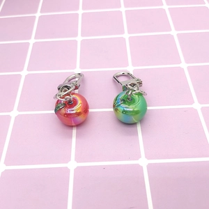 Mini simulated apple keychains with electroplated AB gradient rainbow finish on pink grid