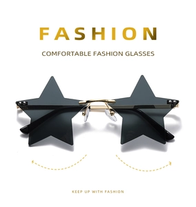 Detail view of pentagram star sunglasses with dark black lenses and gold metal frame