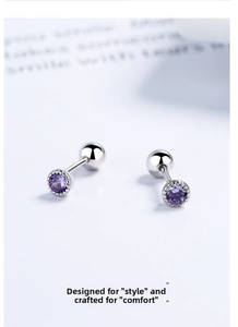 Detailed close-up of round purple zircon ear studs with elegant silver beaded edges