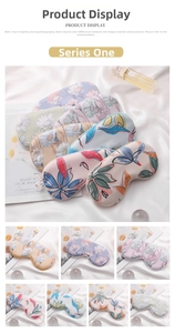 Detail showing various printed silk sleep masks with floral and tropical leaf patterns