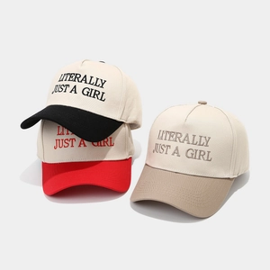 Three minimalist two-tone baseball caps with Literally Just A Girl embroidery text