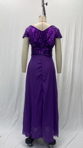 Detail of purple sequin bodice and flowing chiffon skirt on elegant V-neck evening gown