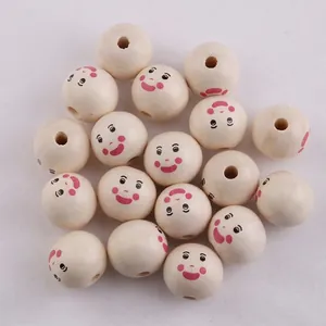 Macro view of 20mm natural wood beads featuring pink blush smiley face for DIY jewelry