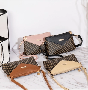 Detailed view of four colorful crossbody bags with geometric circular patterns and metal clasps